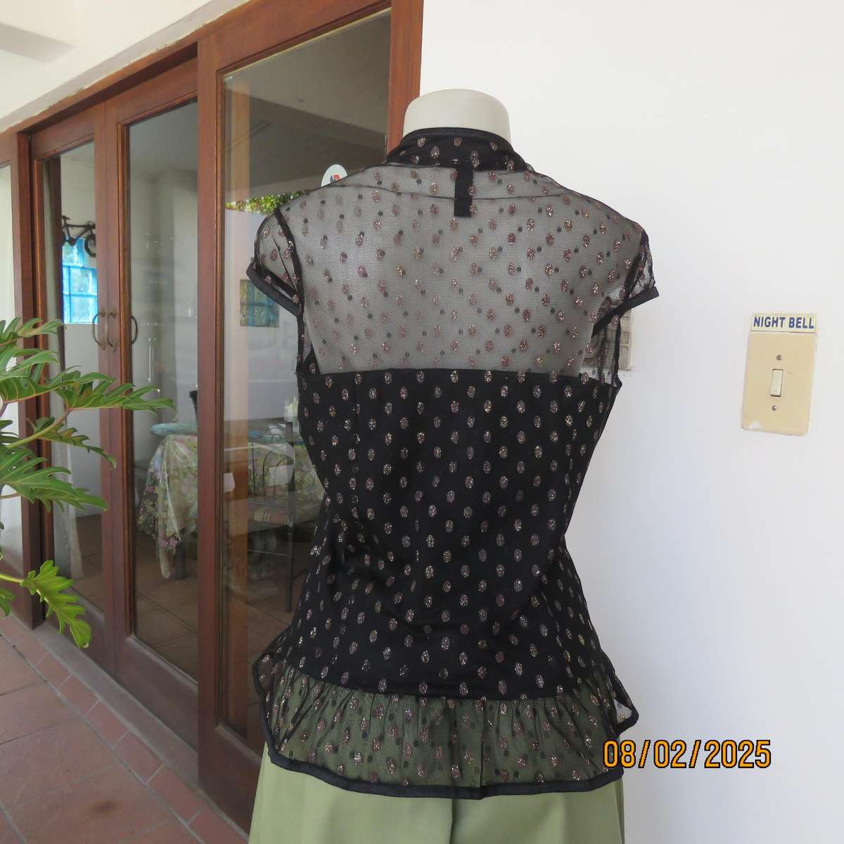 WWW black sheer polyester with oval glitter pattern peplum top. Size 36