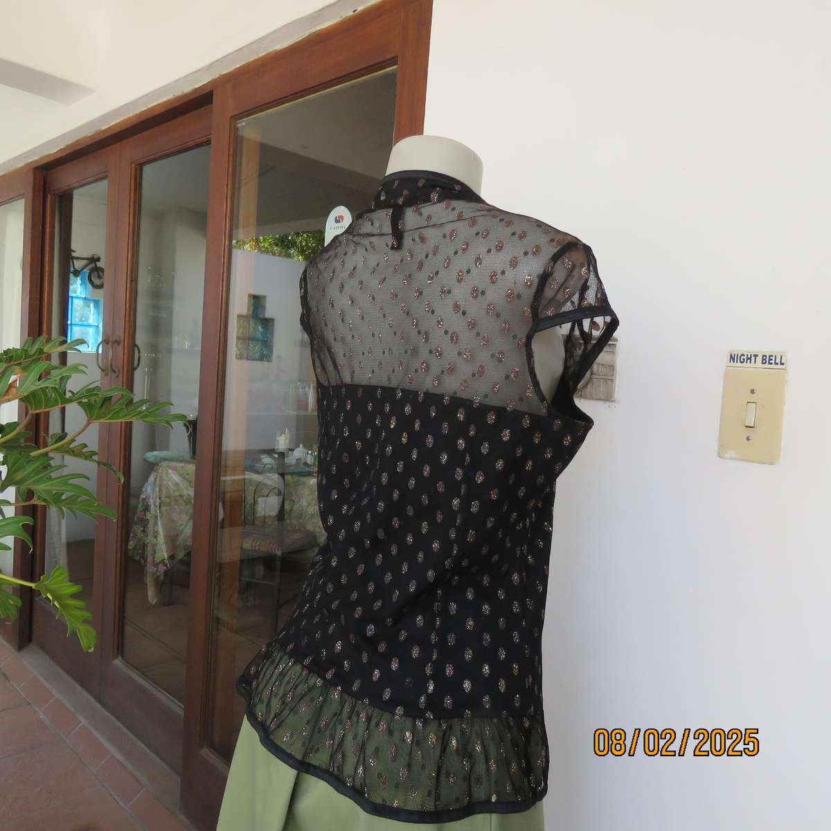 WWW black sheer polyester with oval glitter pattern peplum top. Size 36