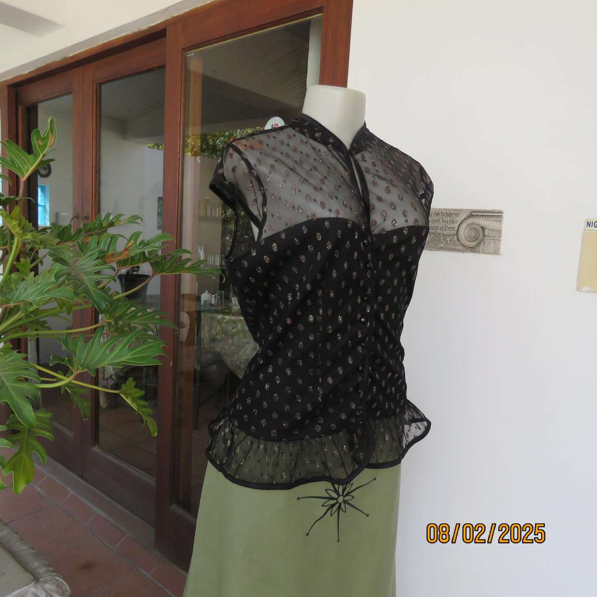 WWW black sheer polyester with oval glitter pattern peplum top. Size 36