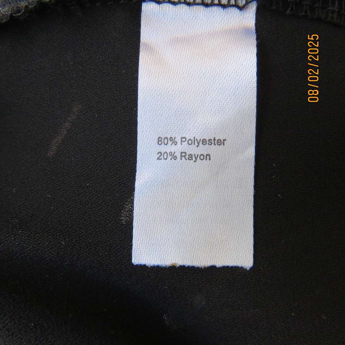 FASHION EXPRESS very black slip over V fringed front top size 38.