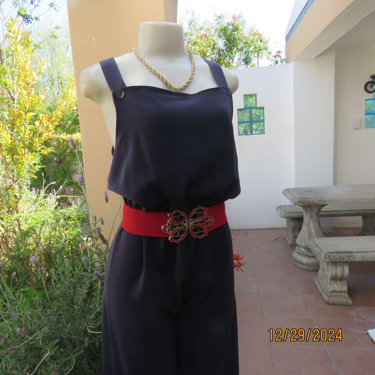 Boutique made dark navy polyester satin like pantsuit size 36. Shoulder straps. As new.