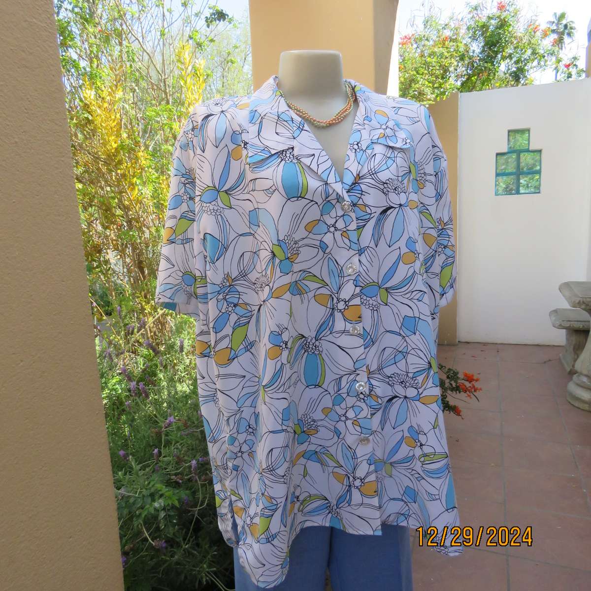 Beautiful CELLINI button down/open collar short sleeve top. Size 48/50.White/blue/peach floral.