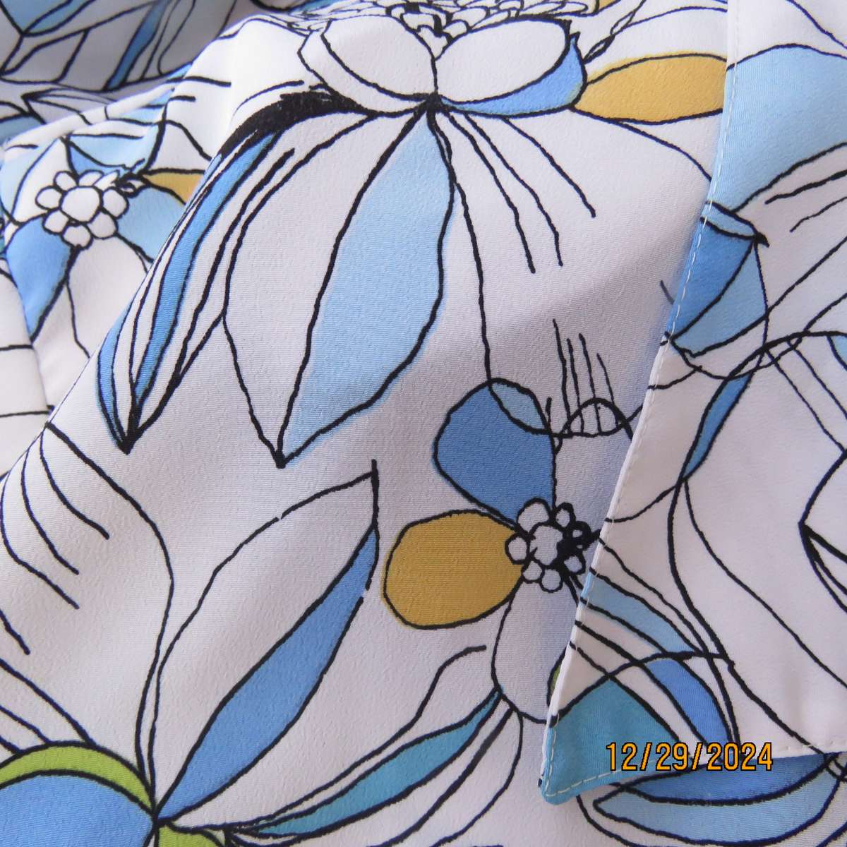 Beautiful CELLINI button down/open collar short sleeve top. Size 48/50.White/blue/peach floral.