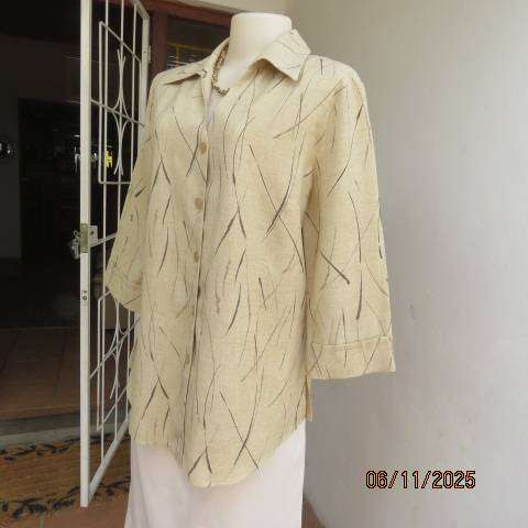 Rich cream textured polyester button down top with brown print. Size 38-40