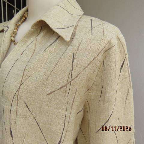 Rich cream textured polyester button down top with brown print. Size 38-40