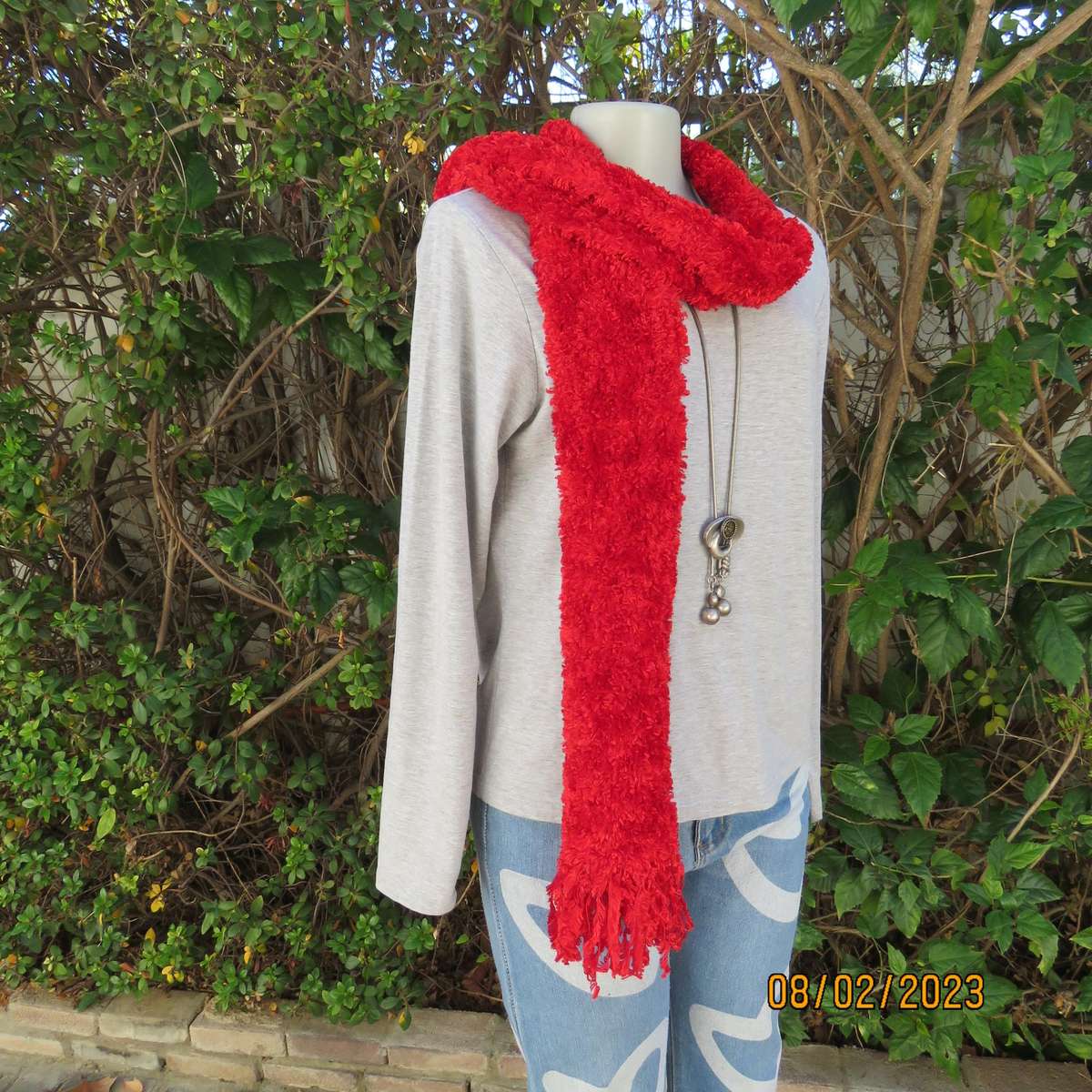 Red fluffy acrylic long narrow scarf. Length 2m x 16cm. As new