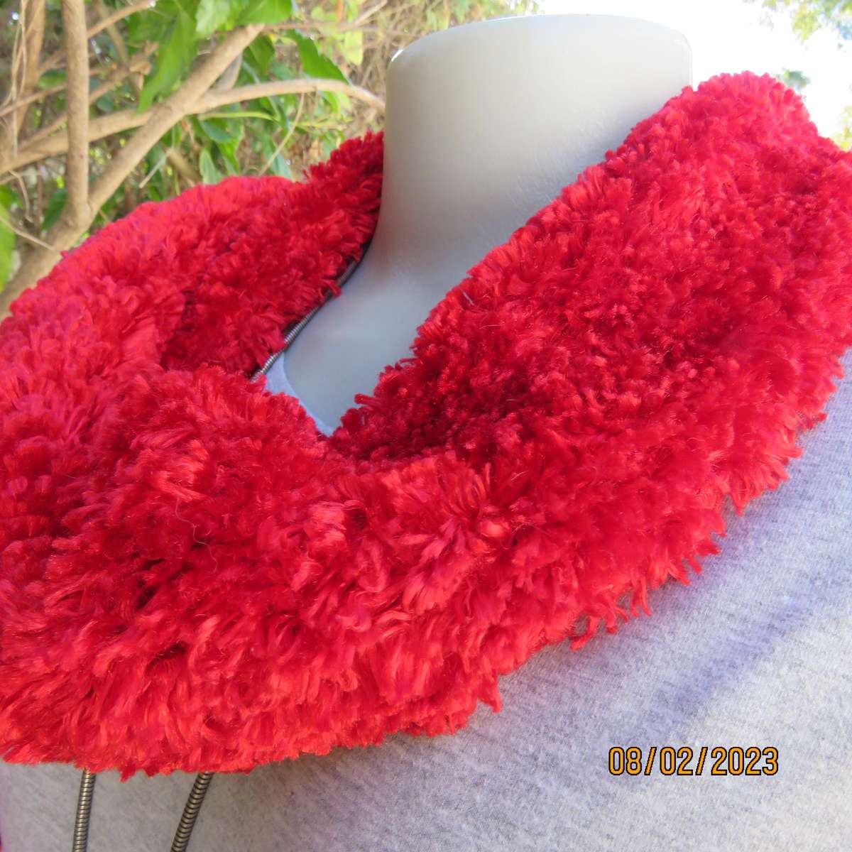Red fluffy acrylic long narrow scarf. Length 2m x 16cm. As new