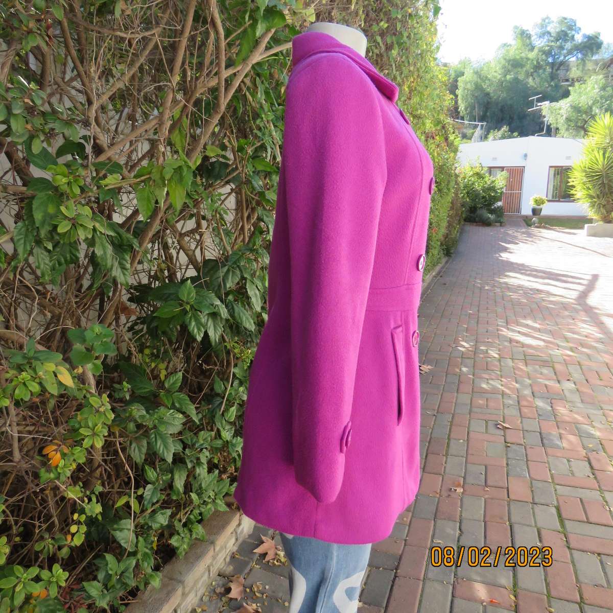 Magenta pink long size 34 warm jacket with double breast look.