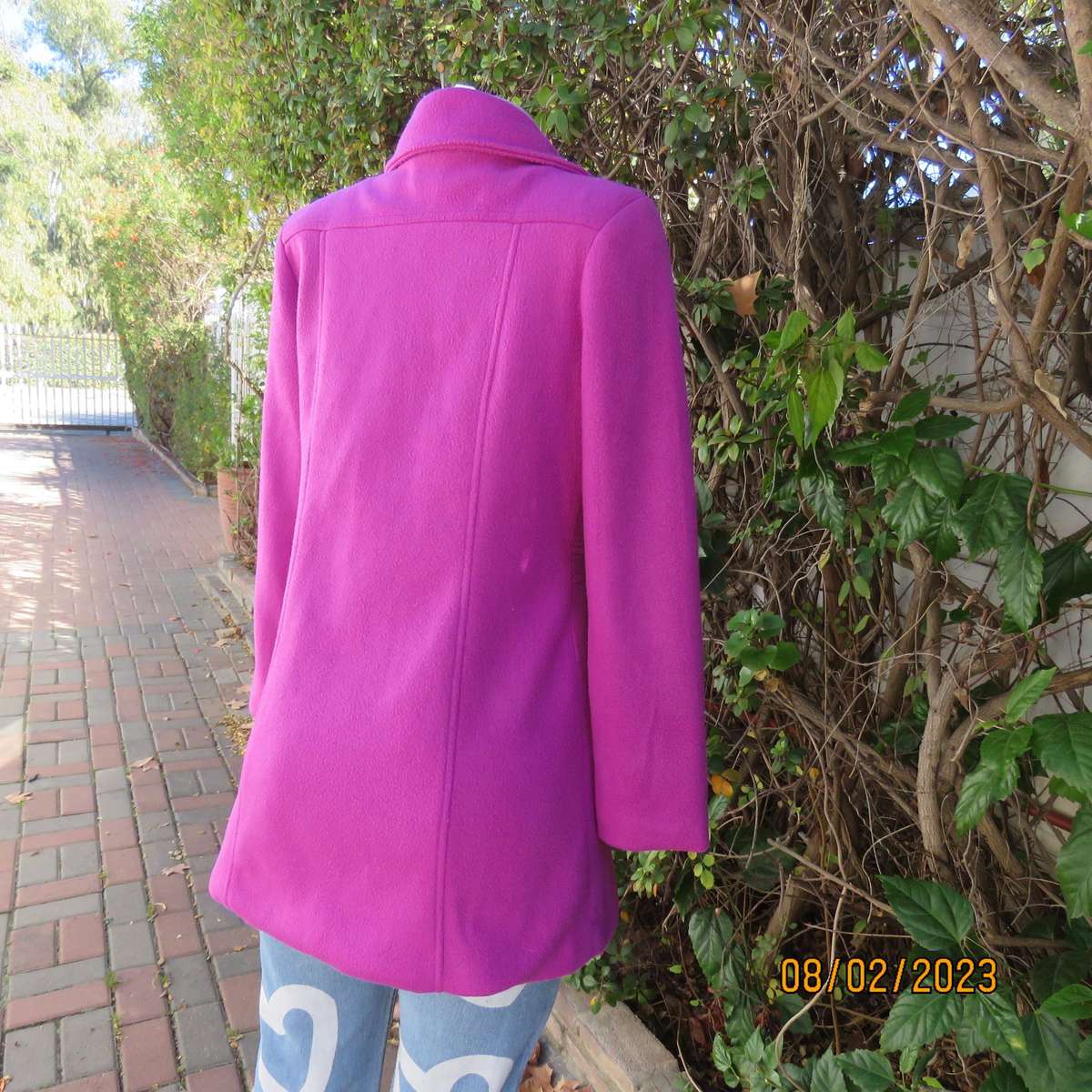 Magenta pink long size 34 warm jacket with double breast look.