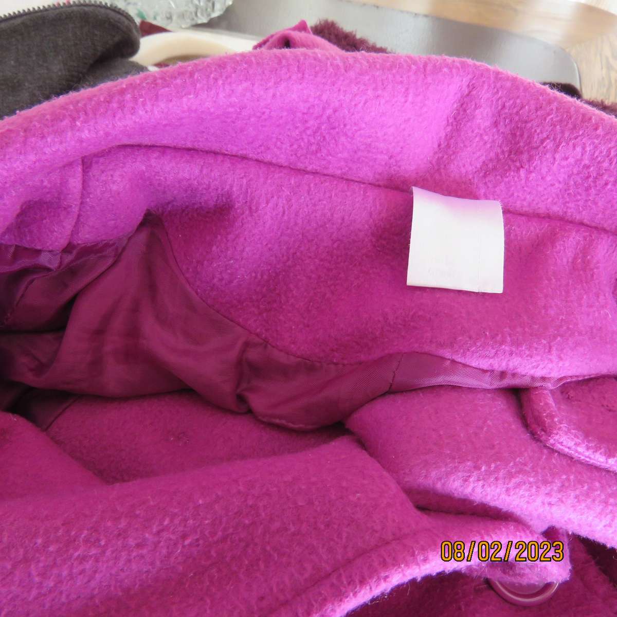 Magenta pink long size 34 warm jacket with double breast look.