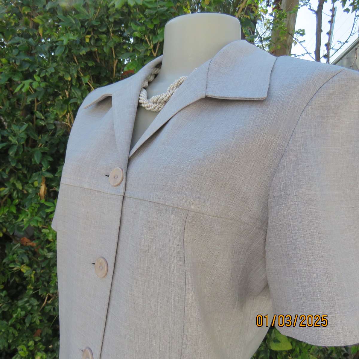 Silver grey mottled polyester short sleeve tailored jacket by NEW ERA size 34. Yoked front. As new