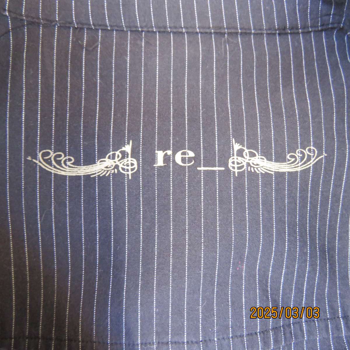 RE black-white pinstripe long sleeve stretch cotton top. Cowboy yokes. Size 36. Hidden button down.