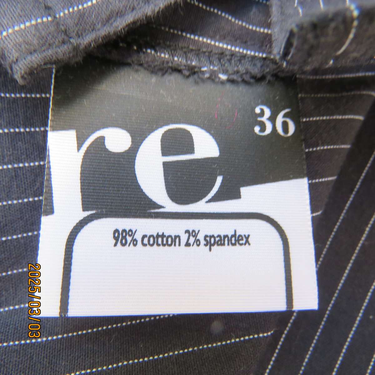 RE black-white pinstripe long sleeve stretch cotton top. Cowboy yokes. Size 36. Hidden button down.