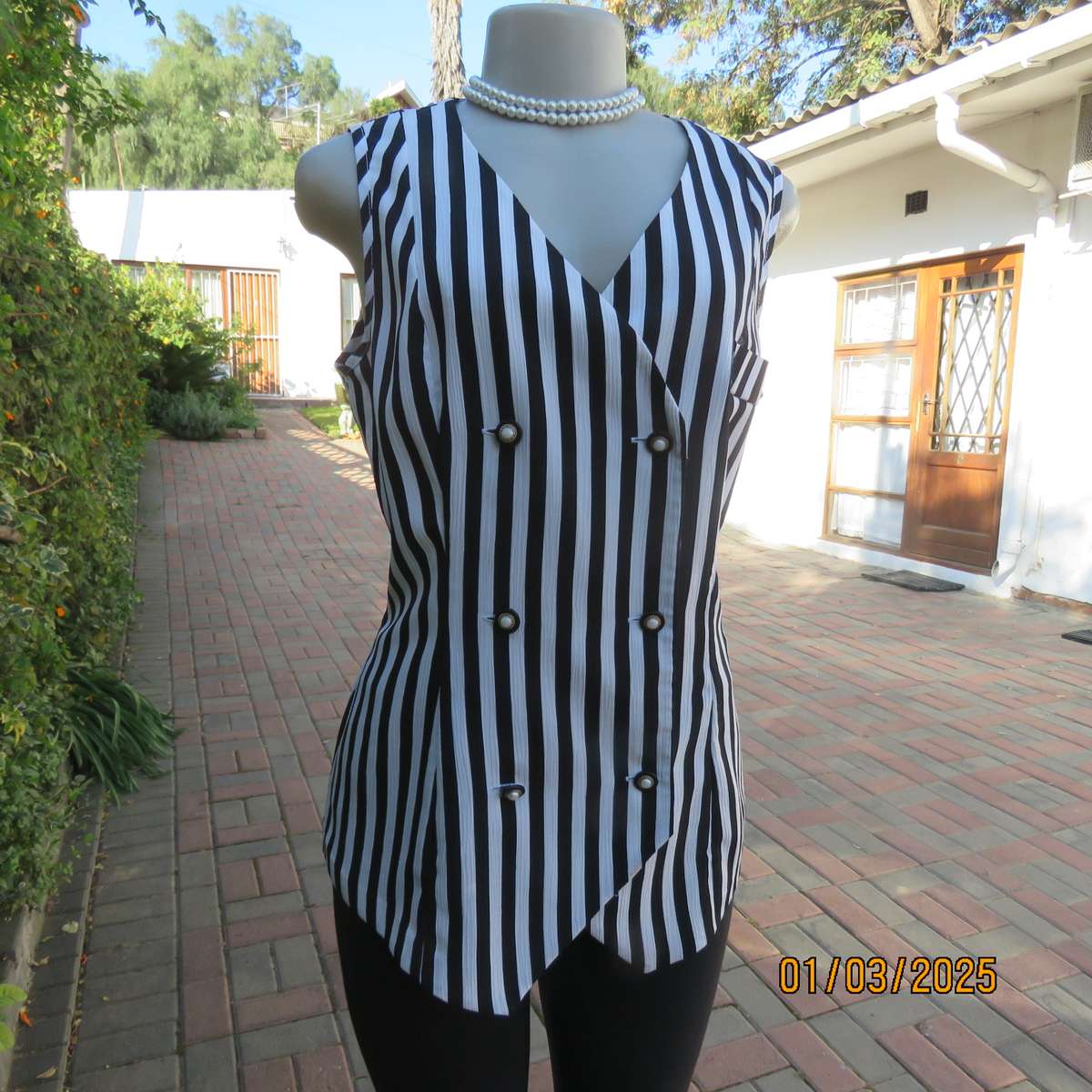 Smart waistcoat style black/white vertical striped crinkled polyester top. Size 38. Double breasted.