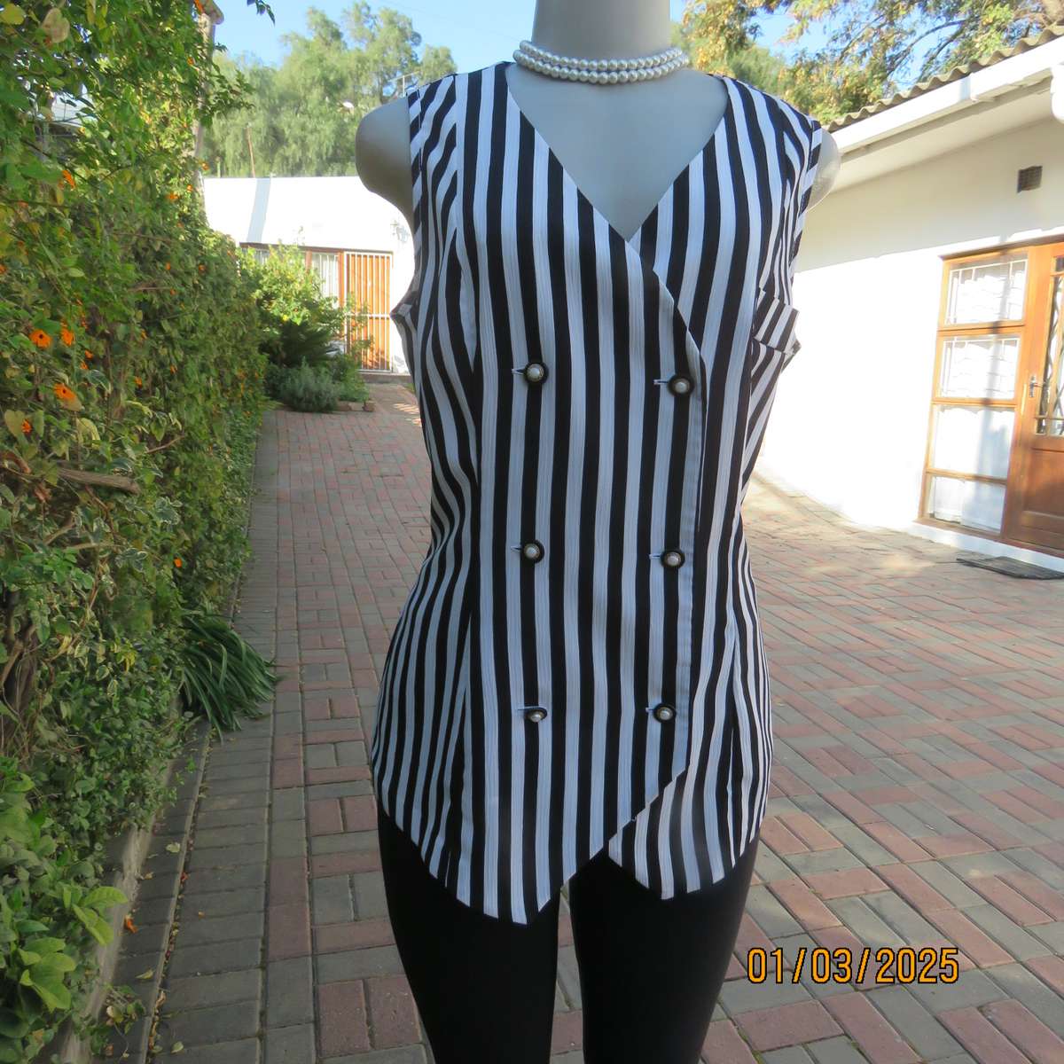 Smart waistcoat style black/white vertical striped crinkled polyester top. Size 38. Double breasted.