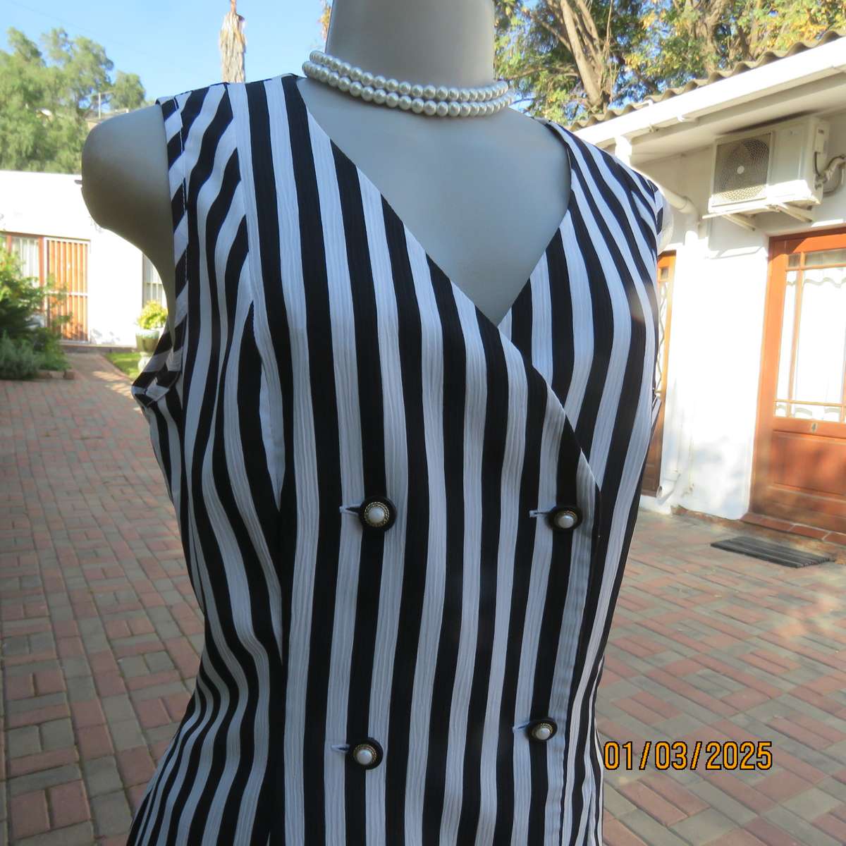 Smart waistcoat style black/white vertical striped crinkled polyester top. Size 38. Double breasted.