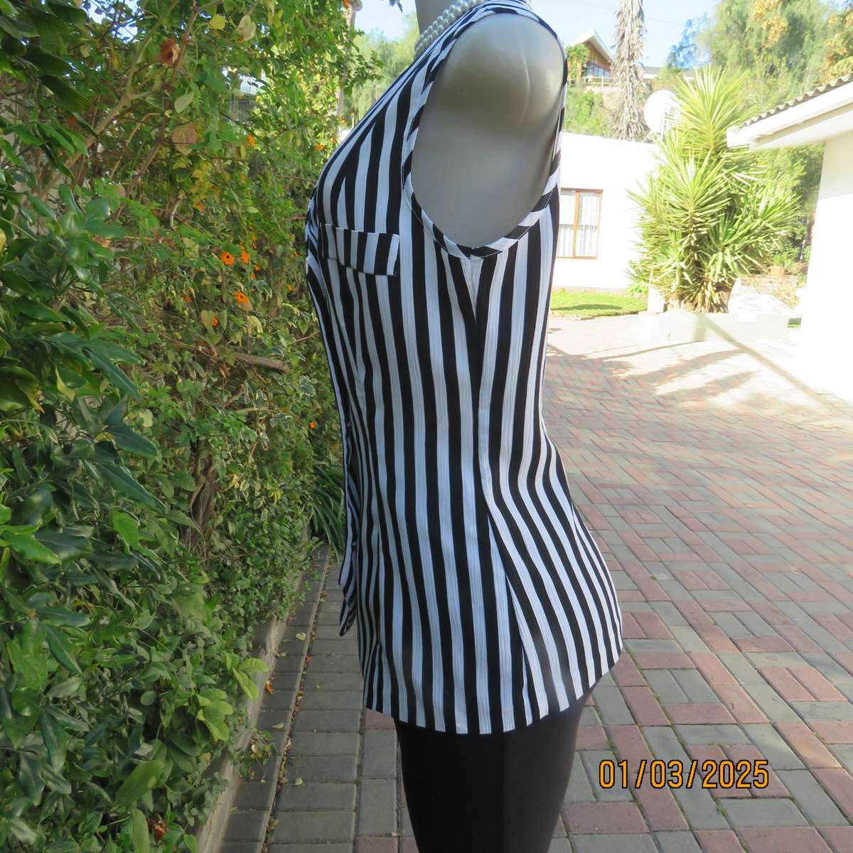 Smart waistcoat style black/white vertical striped crinkled polyester top. Size 38. Double breasted.