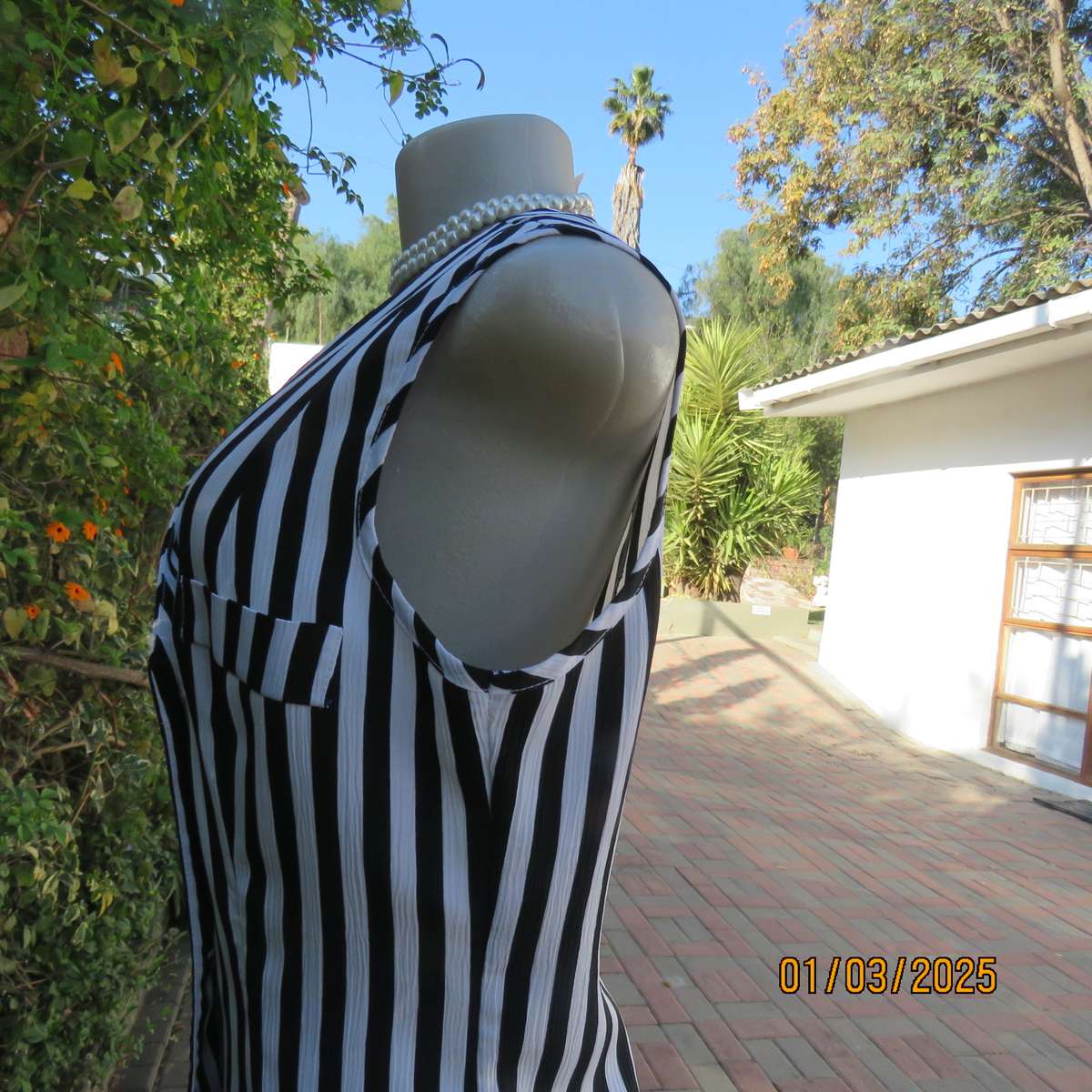 Smart waistcoat style black/white vertical striped crinkled polyester top. Size 38. Double breasted.