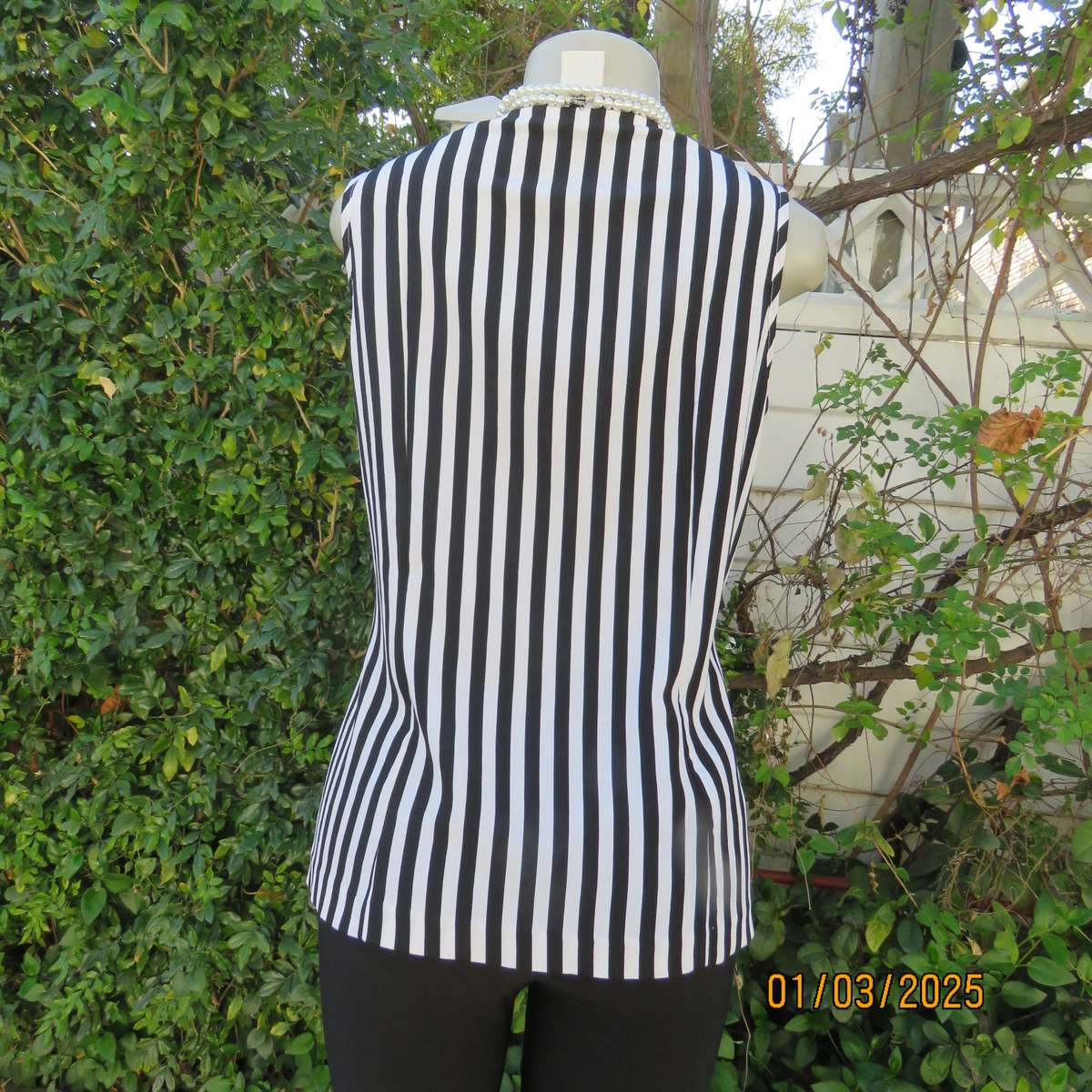Smart waistcoat style black/white vertical striped crinkled polyester top. Size 38. Double breasted.
