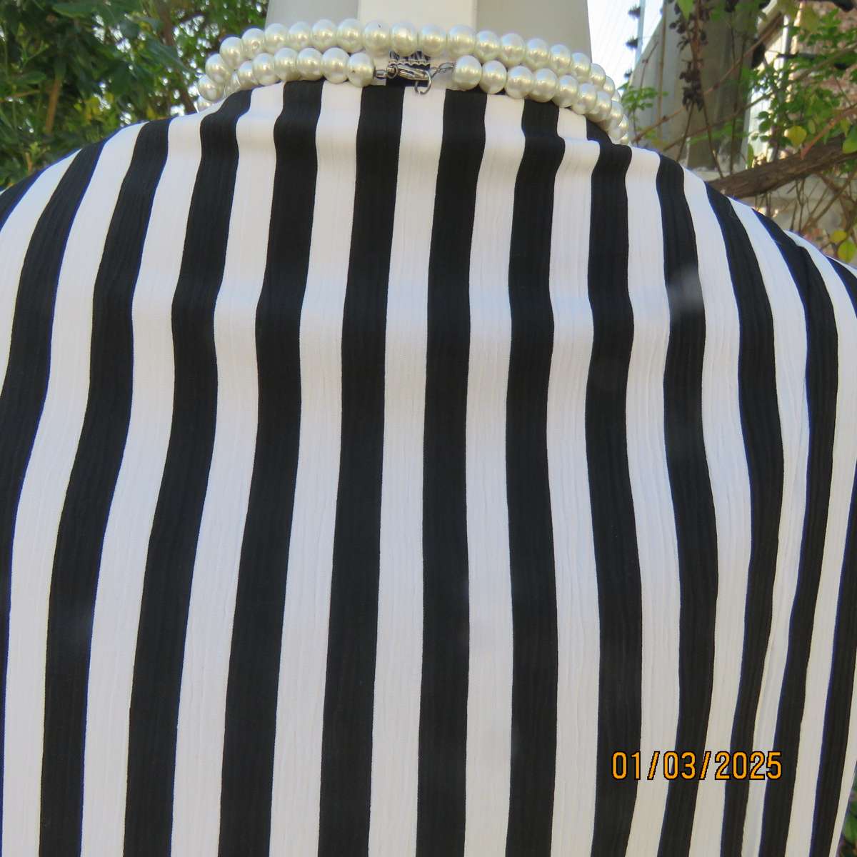 Smart waistcoat style black/white vertical striped crinkled polyester top. Size 38. Double breasted.