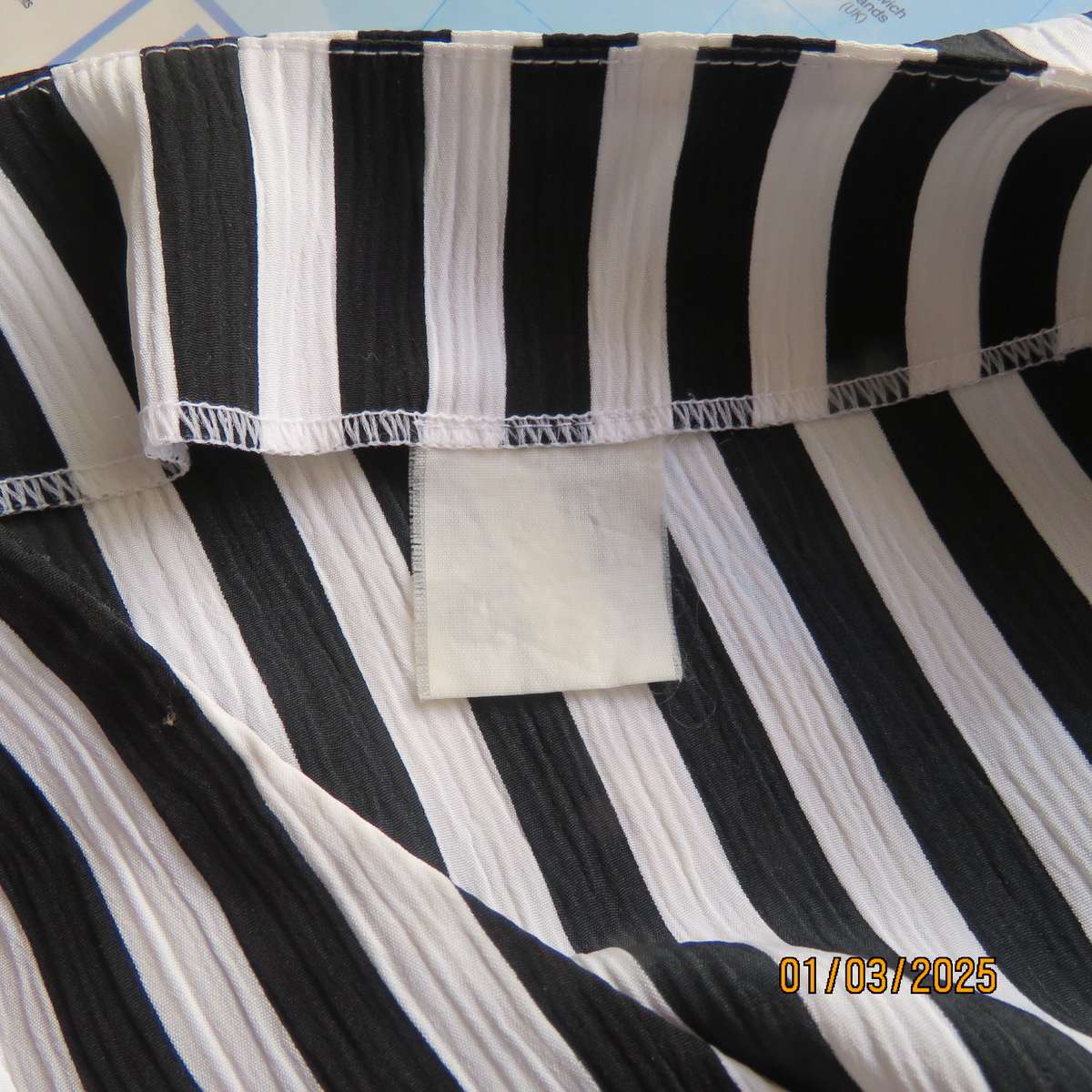 Smart waistcoat style black/white vertical striped crinkled polyester top. Size 38. Double breasted.