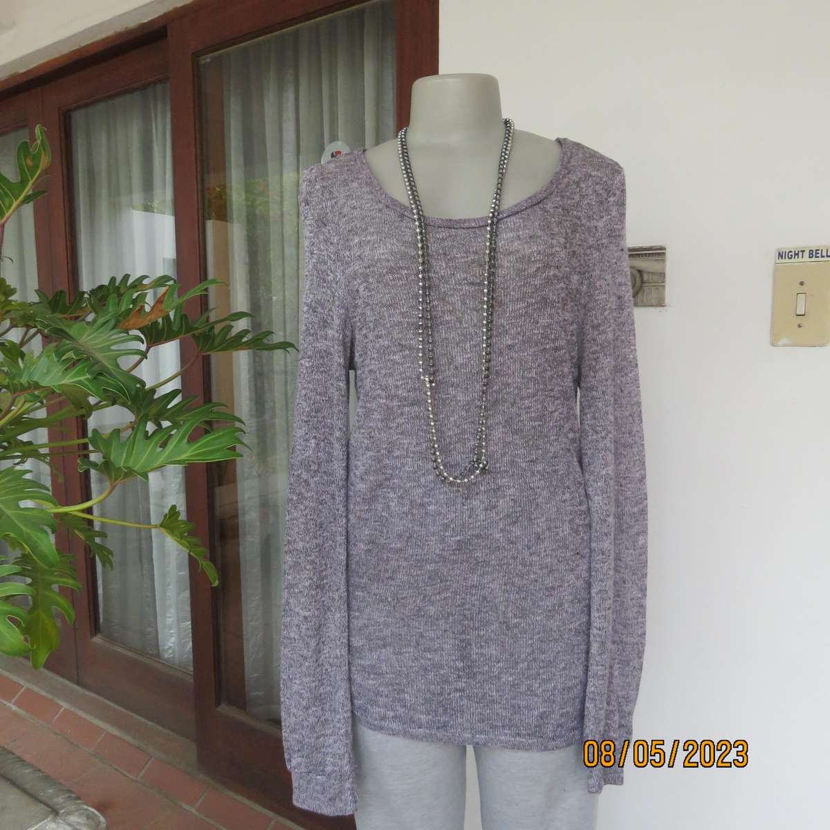 Soft pink-grey mottled extra long polyester-rayon knitted top. Size 38.