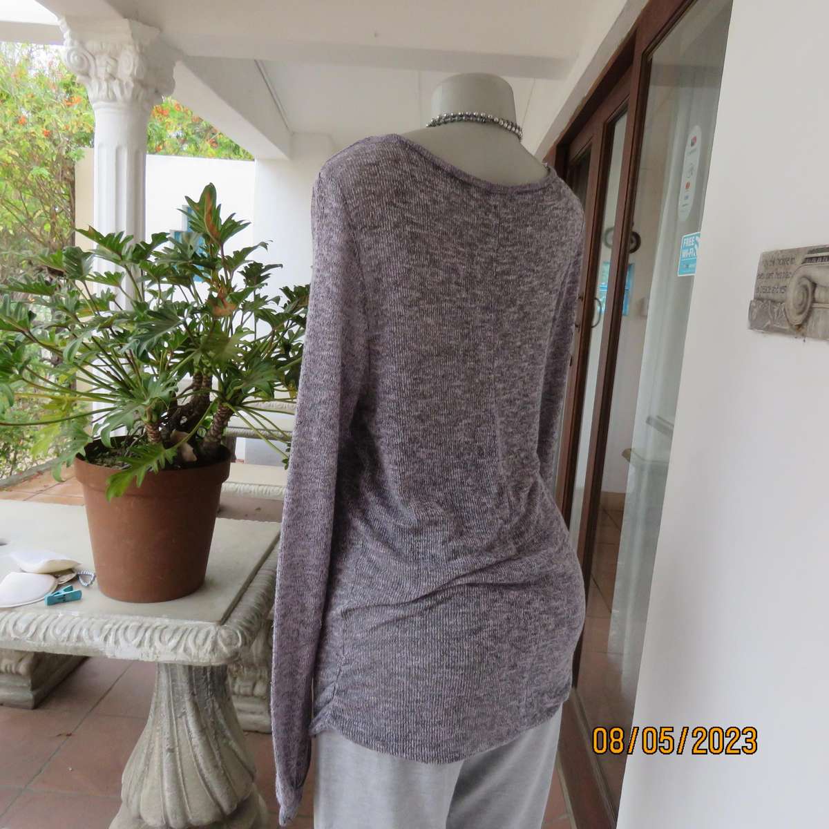 Soft pink-grey mottled extra long polyester-rayon knitted top. Size 38.
