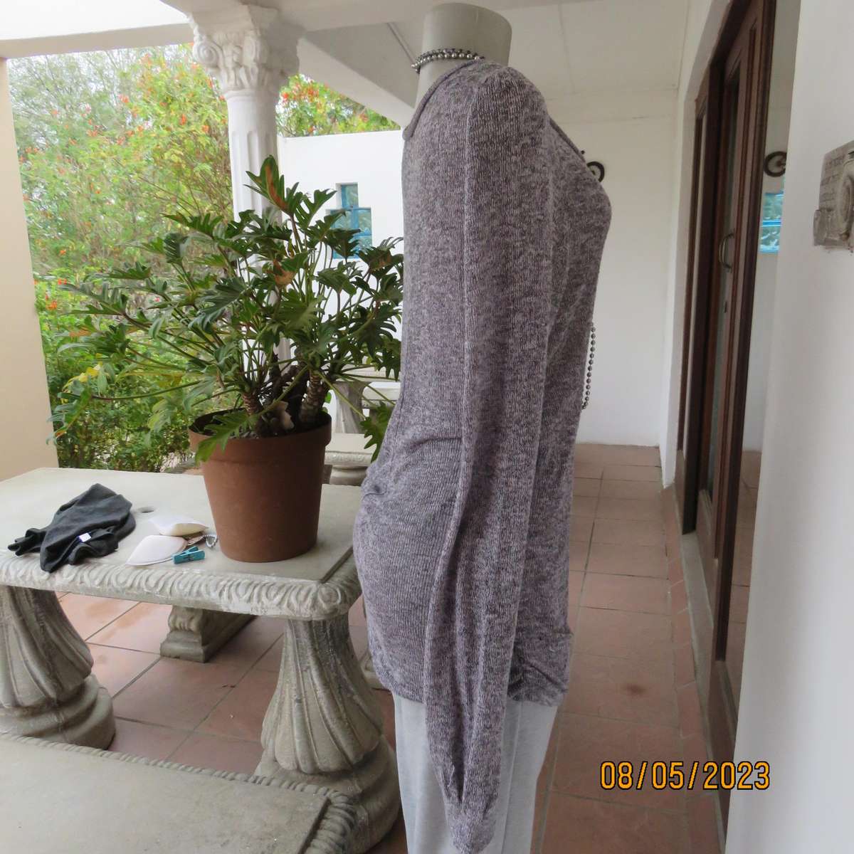 Soft pink-grey mottled extra long polyester-rayon knitted top. Size 38.