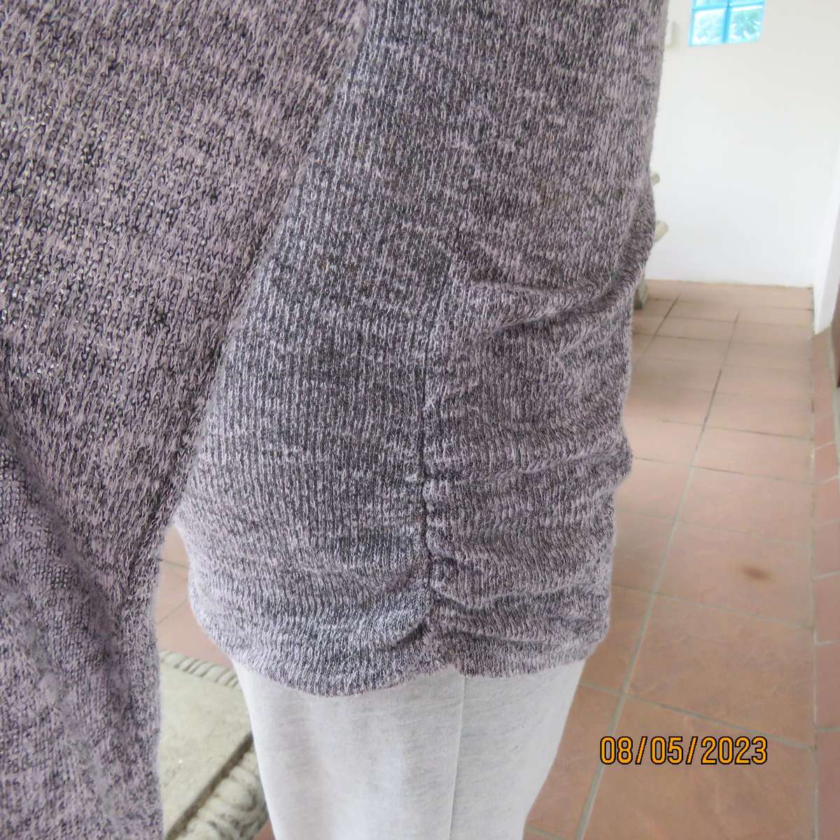 Soft pink-grey mottled extra long polyester-rayon knitted top. Size 38.