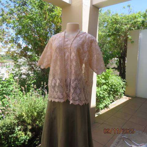 Blushing apricot acrylic lace slip over short sleeve top. Scalloped edging. Size 42