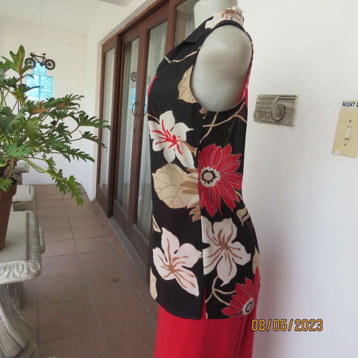 EXACT black sleeveless polyester top with red-cream flowers. Size 34