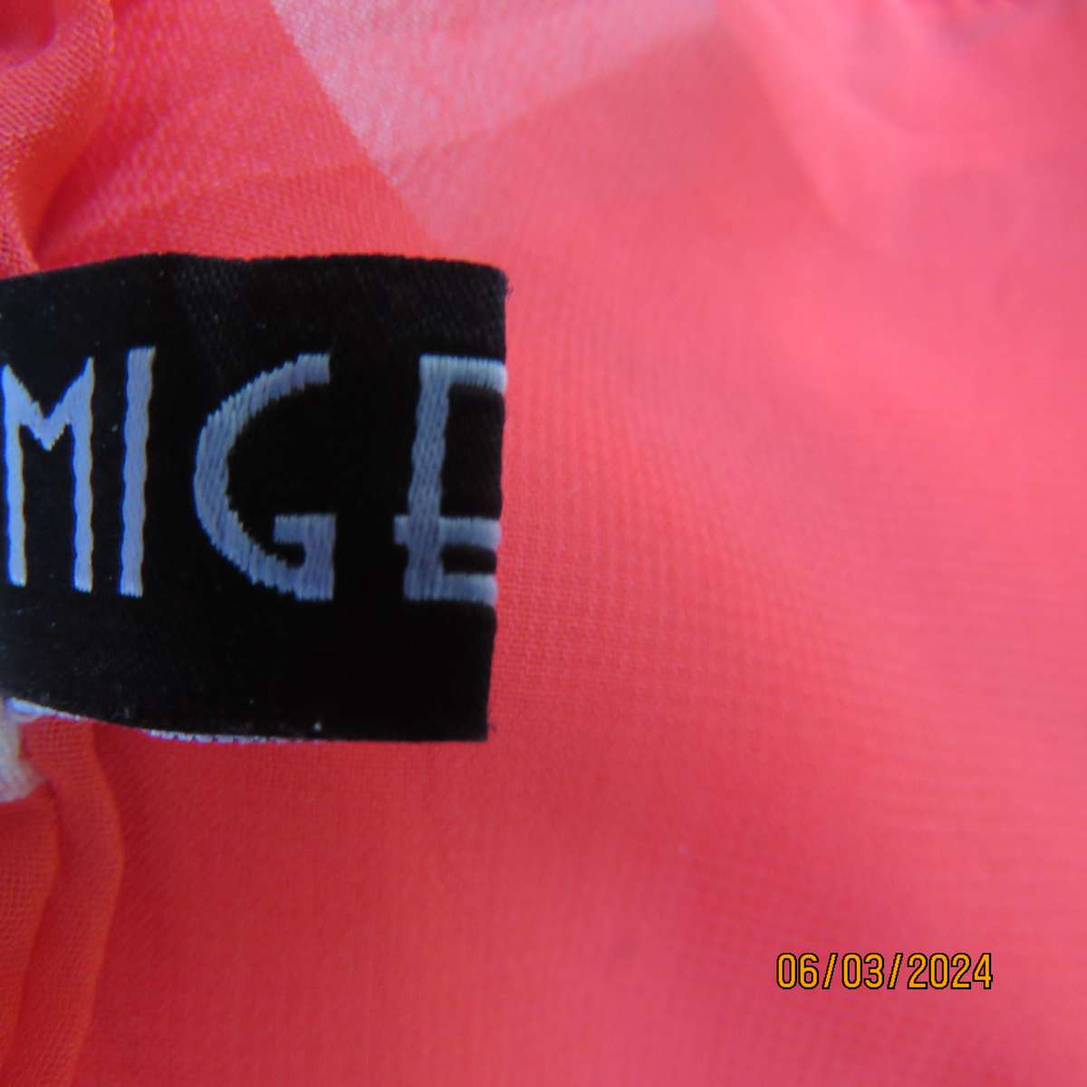 MIGEER poly-rayon red fully lined dress. Size 36. Short pleated bottom. V neck top. Capped sleeves