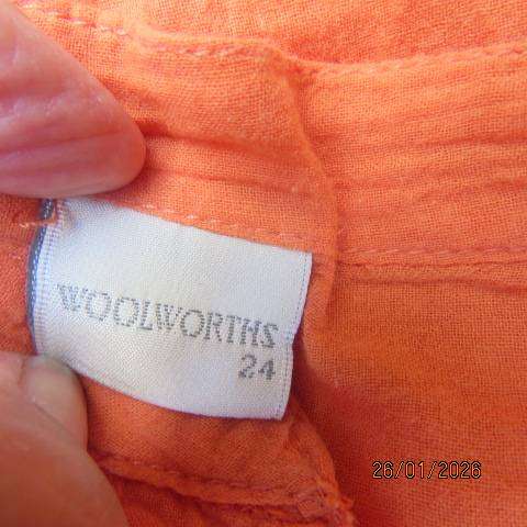 WOOLWORTHS neon orange slightly creased long sleeve slip over cotton top. Size 48