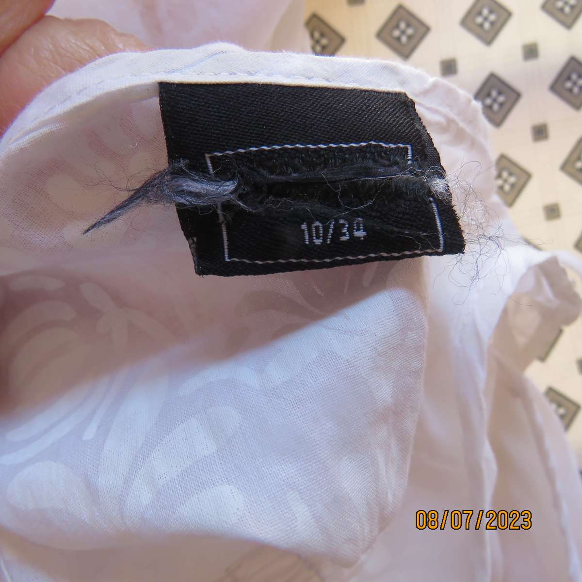 MILADYS white 2 pc floral polycotton sleeveless slip over top. Size 38