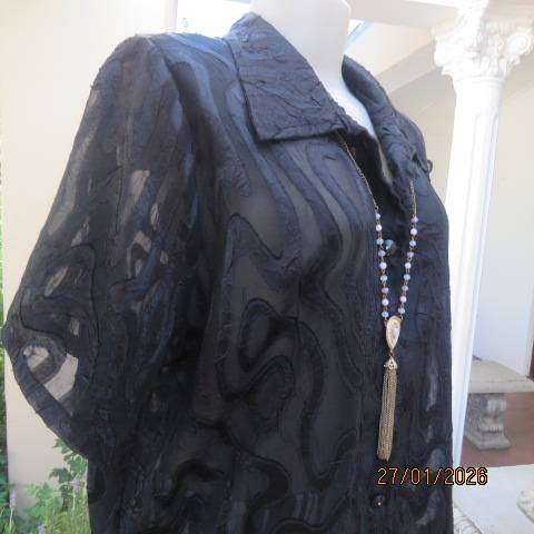 Black opaque embossed sheer polyester button down top with open collar. Size 42.