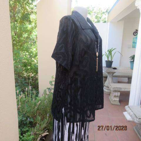 Black opaque embossed sheer polyester button down top with open collar. Size 42.