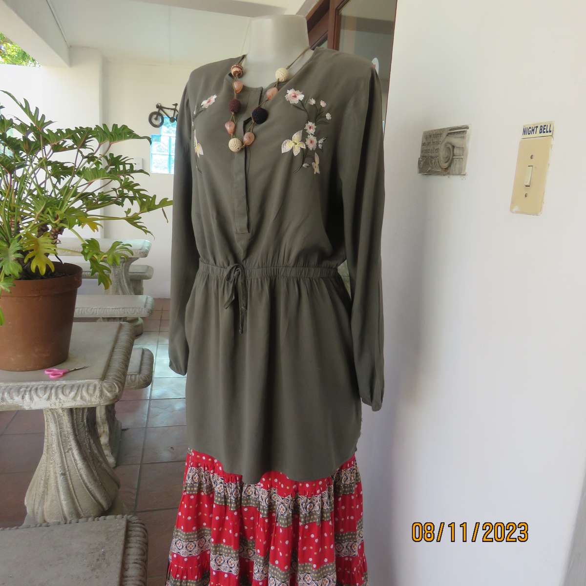 Olive green long viscose top with elasticated waist and front embroidery. Size 40
