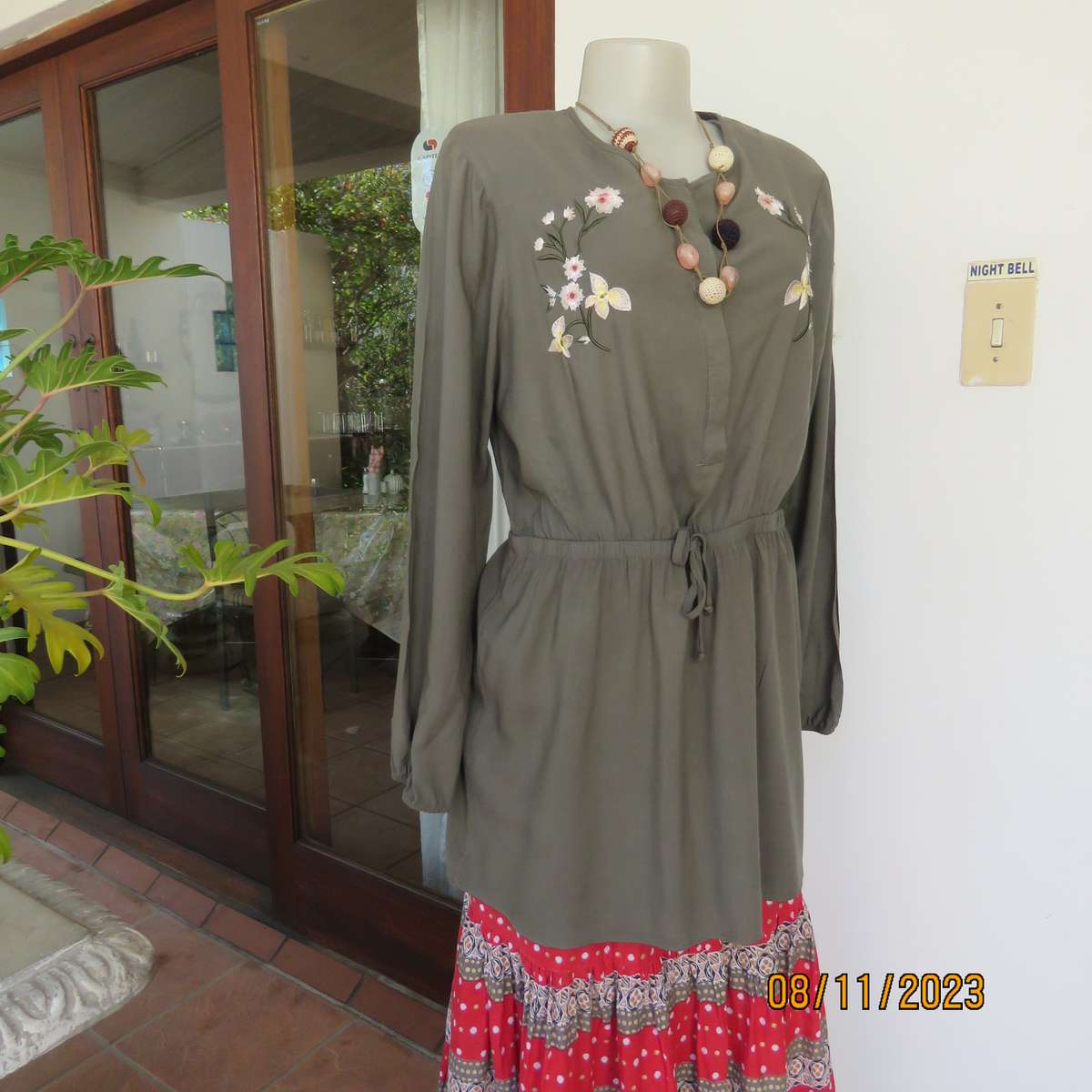 Olive green long viscose top with elasticated waist and front embroidery. Size 40