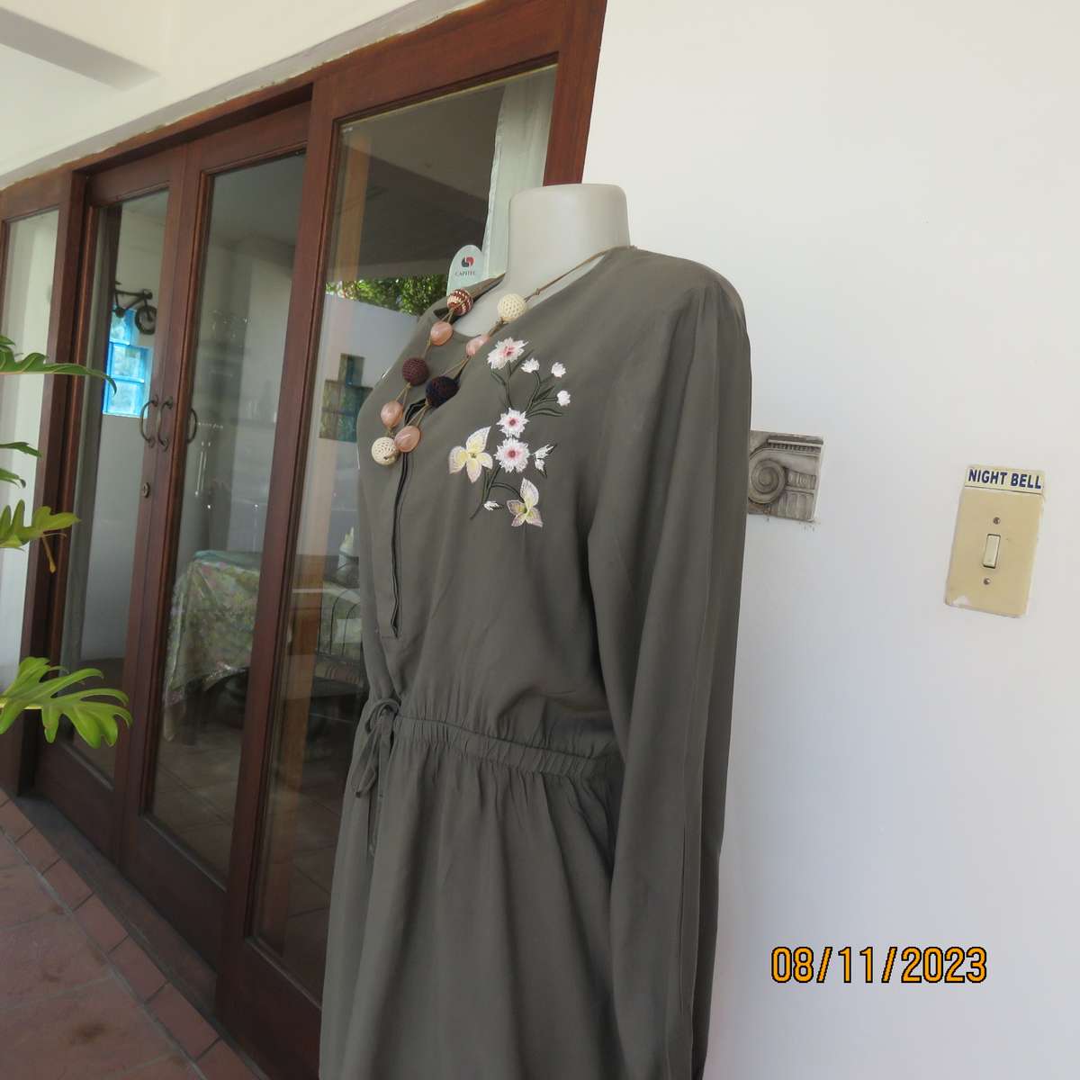 Olive green long viscose top with elasticated waist and front embroidery. Size 40