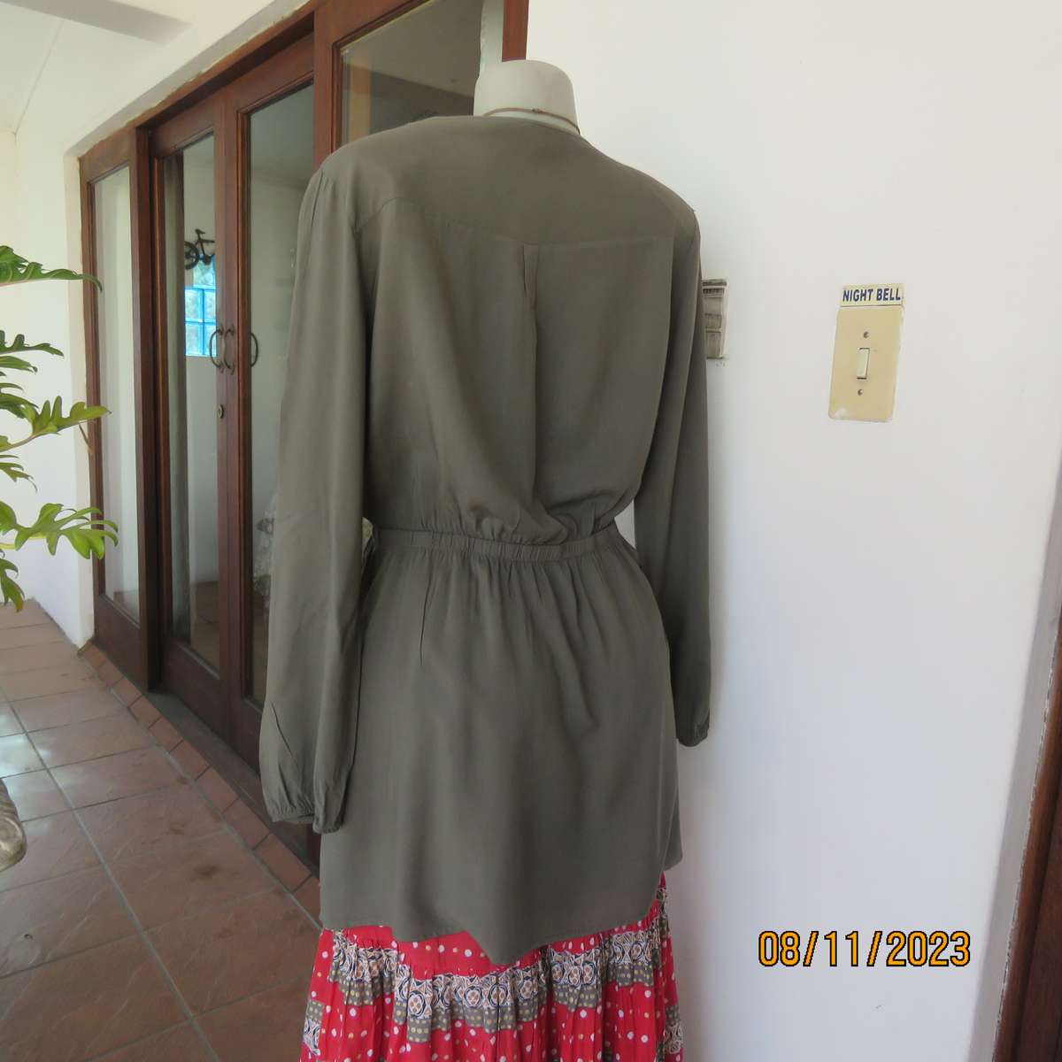 Olive green long viscose top with elasticated waist and front embroidery. Size 40