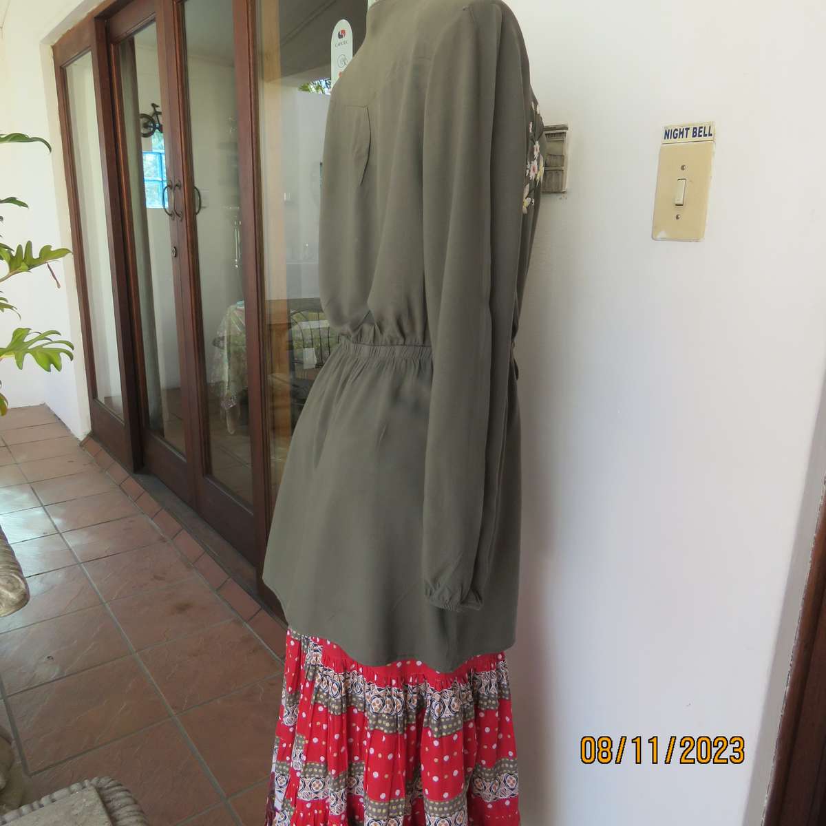 Olive green long viscose top with elasticated waist and front embroidery. Size 40