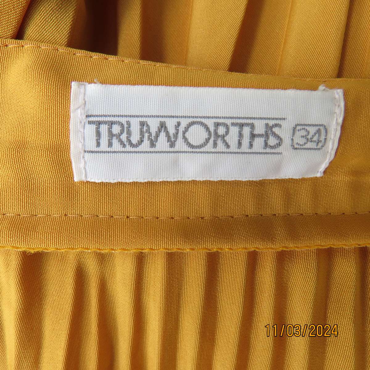 TRUWORTHS mustard colour flare permanent pleated skirt. Size 34.