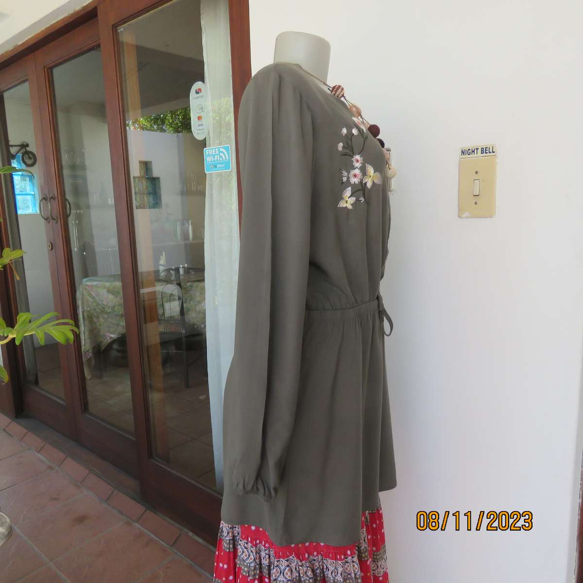 Olive green long viscose top with elasticated waist and front embroidery. Size 40