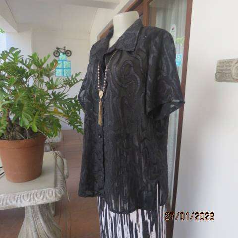 Black opaque embossed sheer polyester button down top with open collar. Size 42.