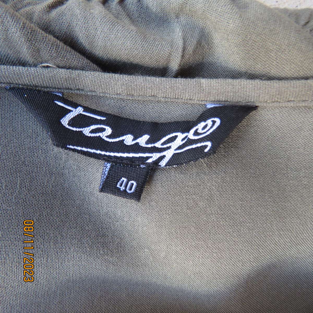 Olive green long viscose top with elasticated waist and front embroidery. Size 40