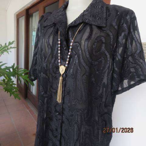 Black opaque embossed sheer polyester button down top with open collar. Size 42.