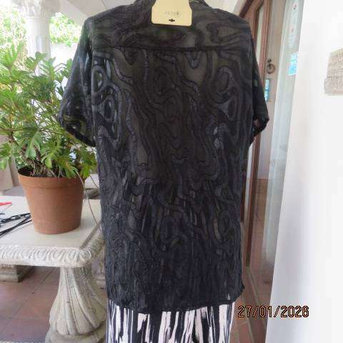 Black opaque embossed sheer polyester button down top with open collar. Size 42.