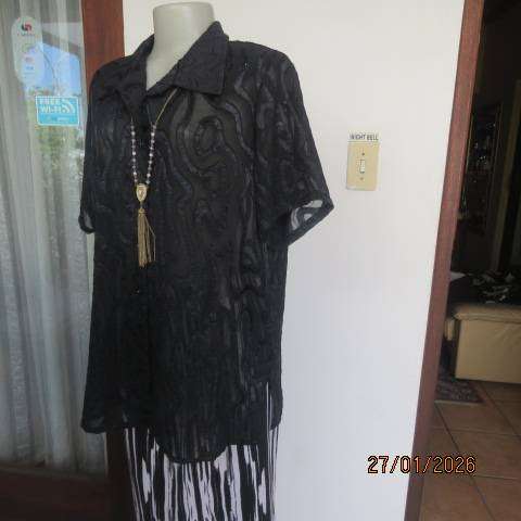 Black opaque embossed sheer polyester button down top with open collar. Size 42.