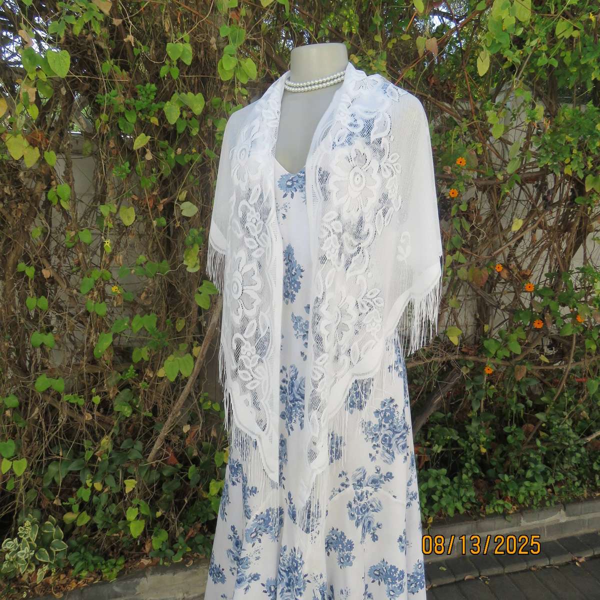 White sheer polyester triangle shawl with scalloped fringed edging. New
