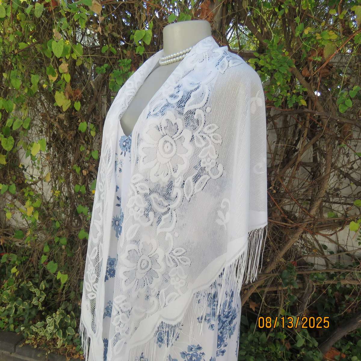 White sheer polyester triangle shawl with scalloped fringed edging. New